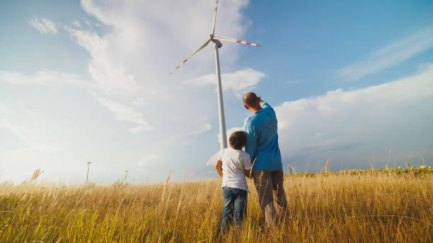 istock Renewable Energy Education: Father and Son at Wind Farm 2171640505