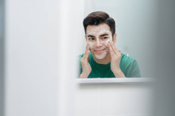 istock Young asian man cleaning face in bathroom 2171644313