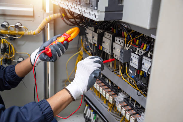 istock Checking the electrical system, an electrician is using an electric meter to check the electrical system at a control cabinet. for safety 2171646682