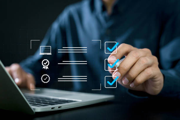 istock quality assurance concept Businessman makes a checklist to certify ISO and standards of products or goods. for the quality of the business 2171646685