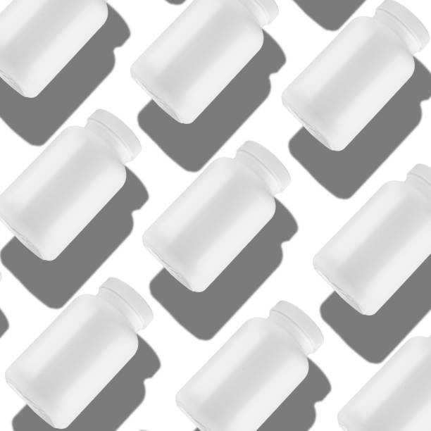 istock White medicine bottles, on a white background, arranged in a neat row at a 45-degree angle. 2171655995