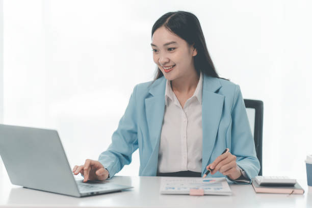 istock Financial professionals and analysts work with documents and calculators to calculate financial reports in their home offices. 2171657773
