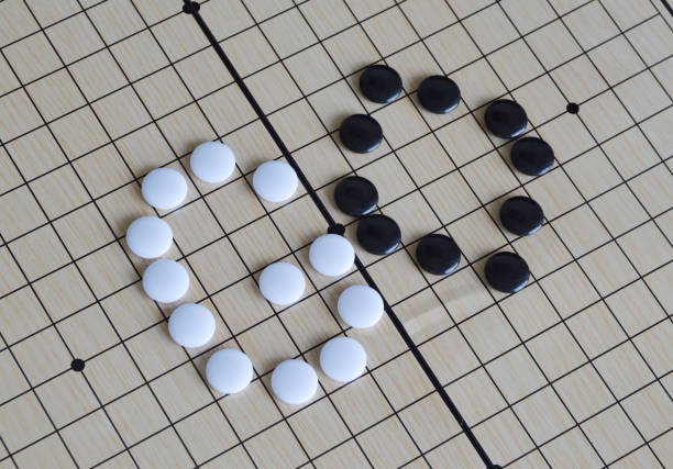 Nine Men's Morris is a two-player game where the objective is to form mills-rows of three pieces. When a mill is formed, an opponent's piece is removed.