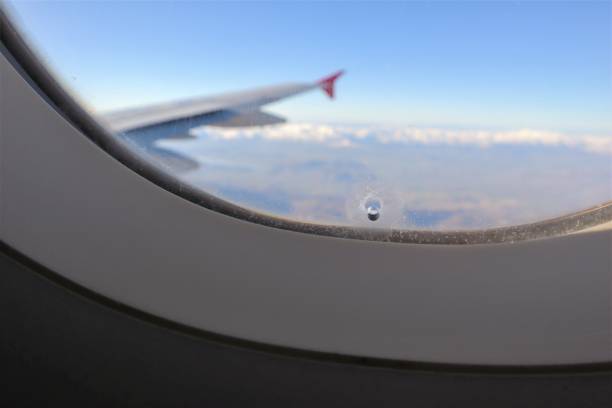 Hole in the airplane window. The hole helps regulate how much pressure from inside the cabin is exerted on the plane's windows. The little hole in airplane window