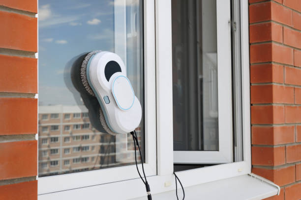 istock Automatic vacuum robot window cleaner washes glass in the apartment, balcony frame. 2171661472