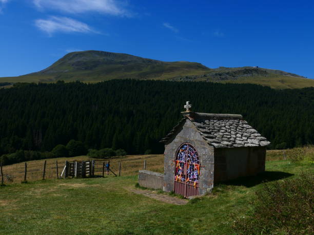 The chapeloune, a small shelter covered with slates which protects a spring gushing from a rock, Vassivière, Puy-de-Dôme, Auvergne