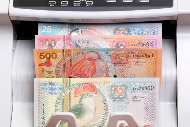 istock Surinamese dollar in the counting machine 2171664654