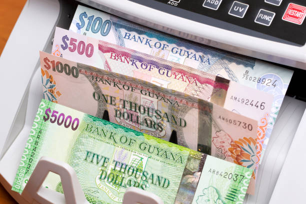 istock Guyanese dollar in the counting machine 2171664672