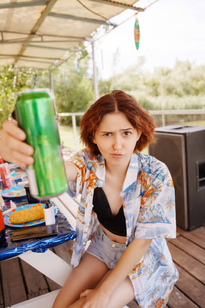istock Cheerful young woman with soda in a can. 2171664990