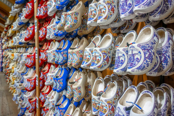 Miniature dutch wooden shoe souvenir on a white background, typical dutch souvenir