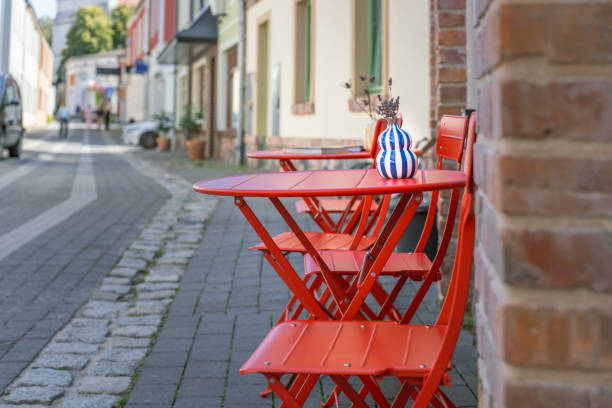 Red wooden cafe tables and chairs in the Montmartre district of Paris
