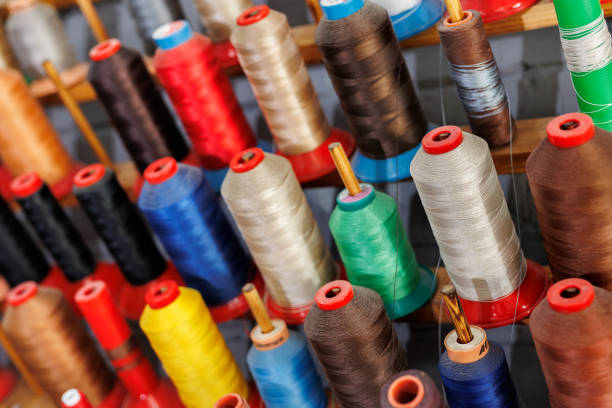 istock Colorful embroidery thread rolls for sewing machine. Industry. 2171666025