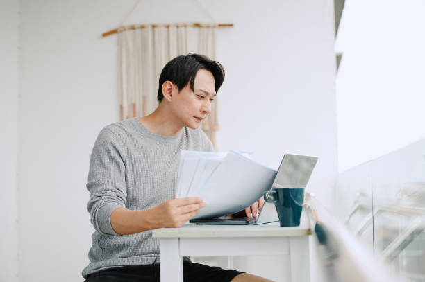 istock Portrait of a man analyzing finance bills. 2171667877