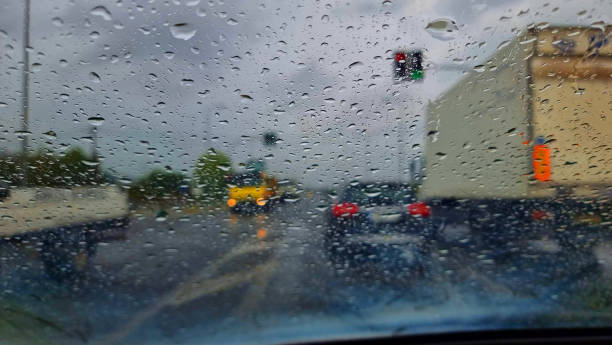 istock rain road glass traffic transportaion window raindrops 2171668976