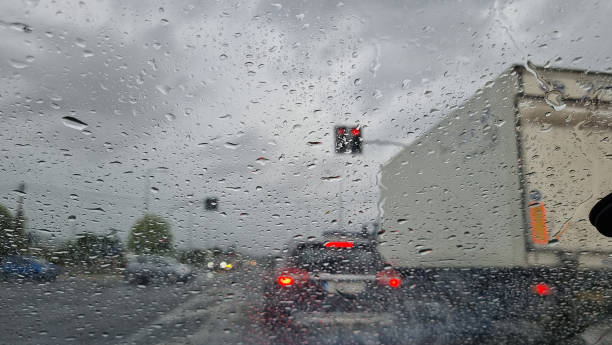 istock rain road glass traffic transportaion window raindrops 2171668981