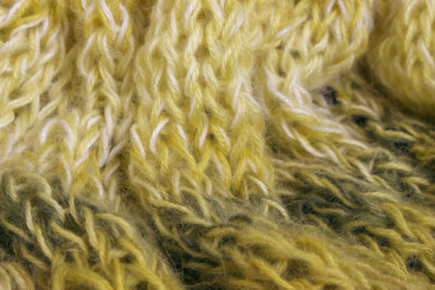 istock Gradient knitted background. Lemon coloured alpaca and wool threads with beautiful knitting pattern. Gradient crochet in warm colours. Knitting hobby. Knitwear concept. 2171669671