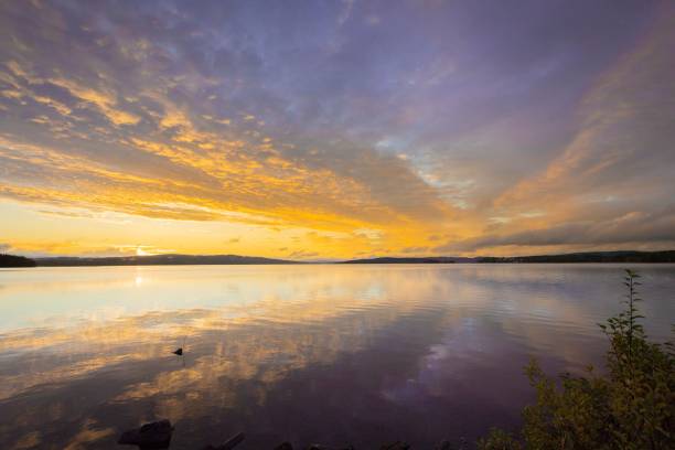 istock Sunset over a calm lake with reflections. 2171672381
