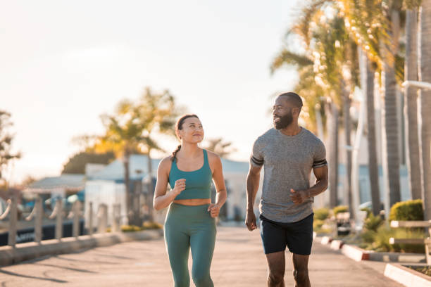 istock Energetic Jogging Pair in Urban Setting 2171672550