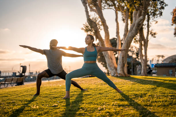 istock Yoga Practice Outdoors with Diverse Duo in San Diego Park 2171672560