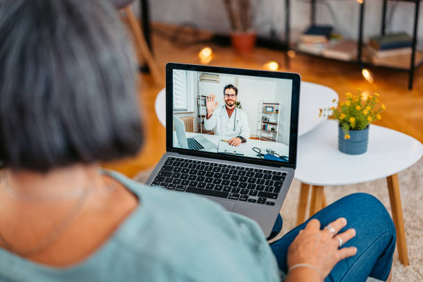 istock Senior Woman Having A Doctor's Appointment Online On The Sofa 2171675573