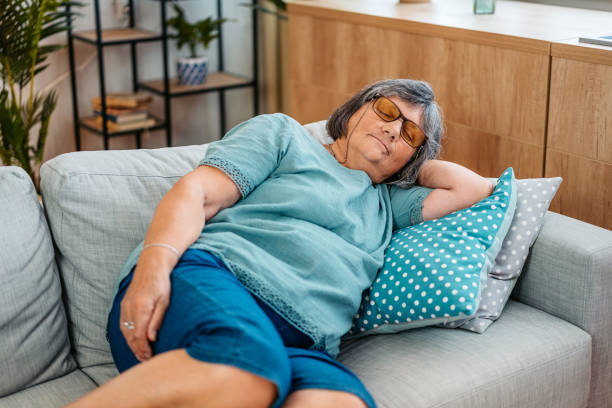 istock Senior Woman Sleeping On The Sofa At Home 2171676632