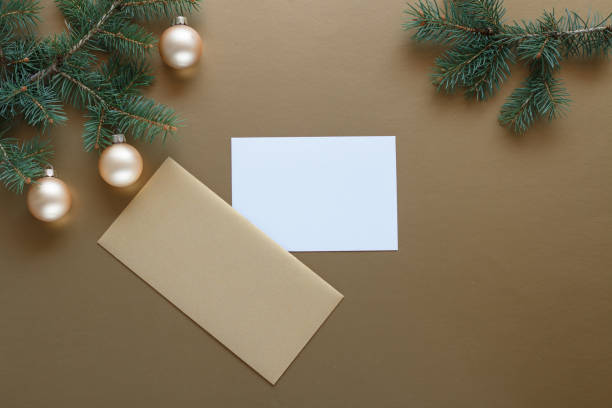 istock Christmas gold envelope with ornaments and pine branches. 2171678006
