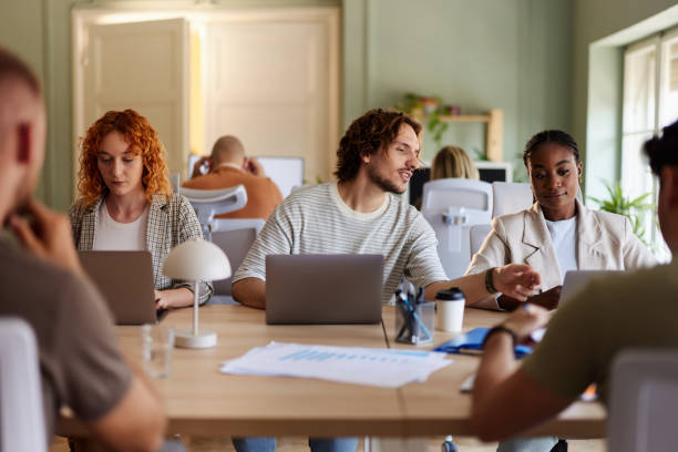 istock Young design professionals working on laptops in the office. 2171679937