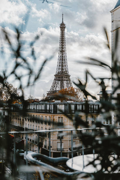 istock The Eiffel Tower seen from bar terrace in Paris, cloudy sky 2171681950