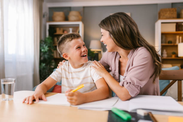 istock Mother and Son Laughing Together During Homework Time at Home 2171682065