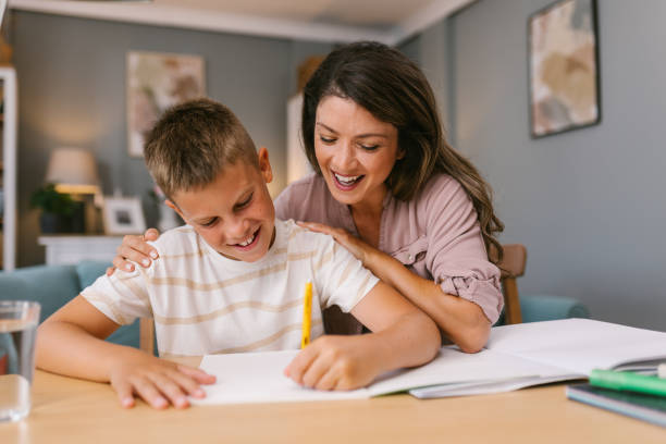 istock Mother and Son Sharing a Joyful Homework Session in a Comfortable Living Room 2171682145