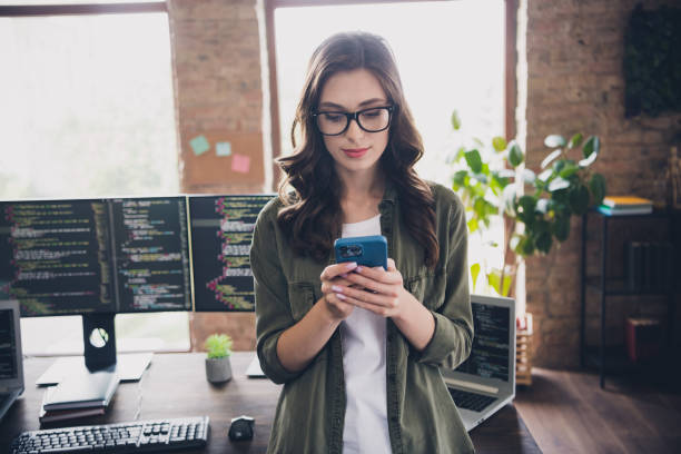 istock Photo of successful lady administrator designer use telephone write website make content fix bugs workstation modern room indoor 2171683849