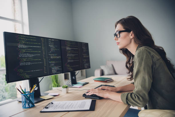 istock Profile side photo of smart focused lady developing site download content install new server reboot operating system indoor workstation 2171683967