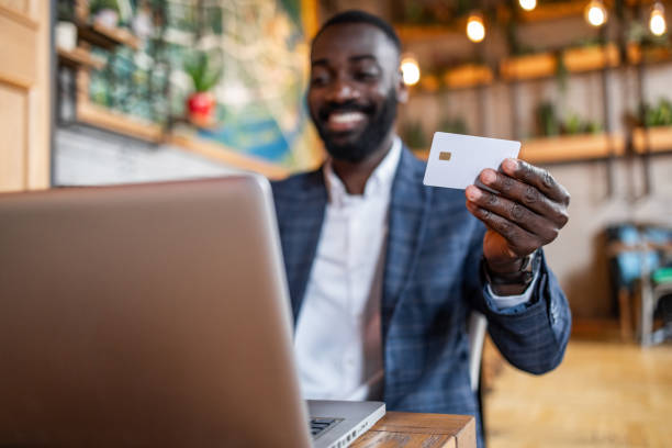 istock Work without borders, laptop, coffee and checking your bank account through e-banking 2171689605