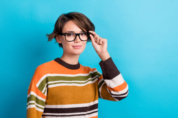 istock Photo of confident cool woman dressed striped pullover hand eyewear empty space isolated blue color background 2171690030