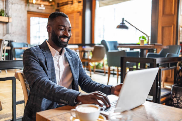 istock Work without borders, laptop, coffee and checking your bank account through e-banking 2171690728