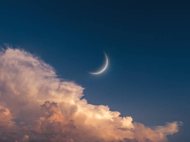 Young Moon in the sky at sunset.