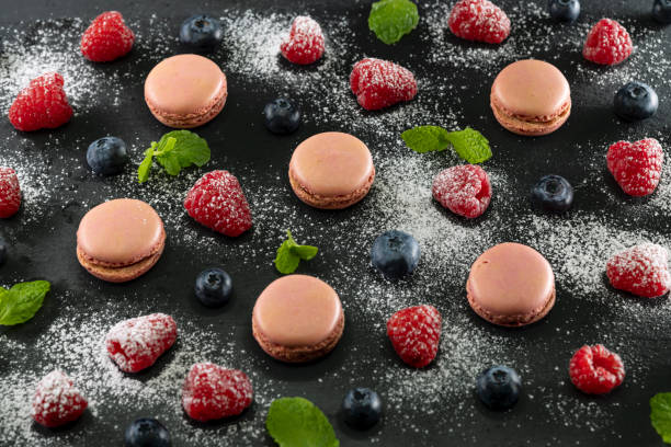 istock macaroons of different colors on a black background 2171694070