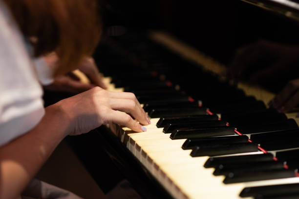 istock A young Taiwanese lady is playing the piano in a cozy setting. 2171695131