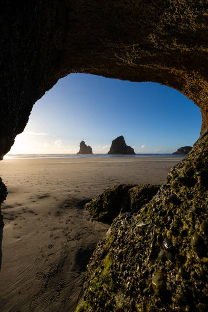 istock Whrariki Beach Cave 2171700276
