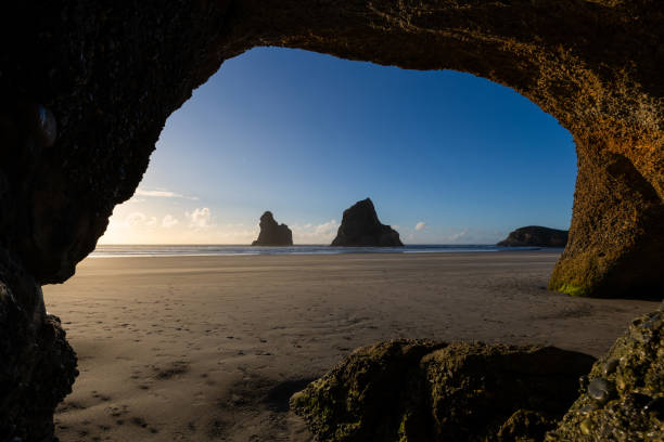 istock Whrariki Beach Cave 2171700307