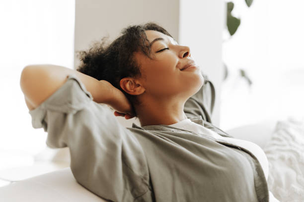 istock Young woman relaxing on comfortable sofa at home 2171700845
