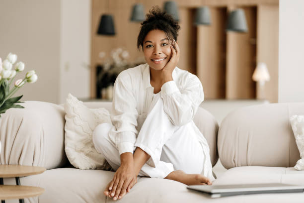 istock Young woman relaxing on comfortable sofa at home 2171701128