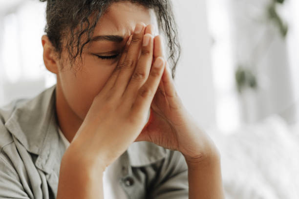 istock Young black woman suffering from a strong headache at home 2171701347