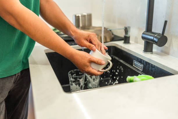 istock Asian Male Engaged in Dish Cleaning at Home 2171703421