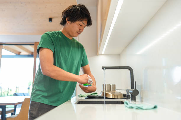 istock Efficient Kitchen Clean-up by Asian Male at Home 2171703423