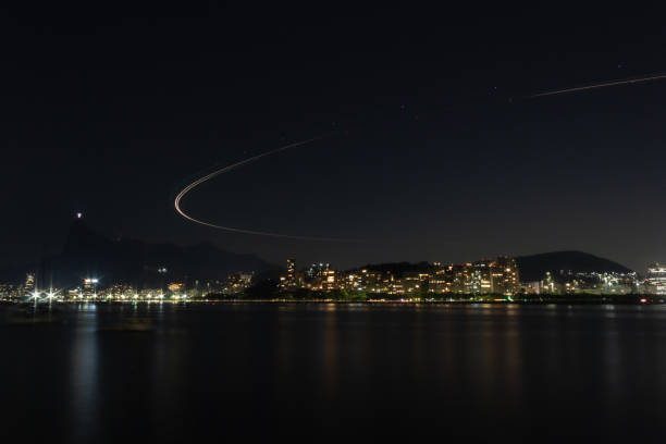 istock Airplane landing light track at night - Mureta da Urca, Rio de Janeiro 2171703572