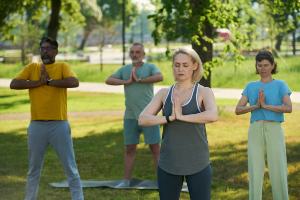 istock Doing yoga exercises in summer park 2171703638
