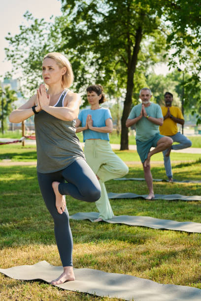 istock Showing yoga exercise to elderly people 2171703693