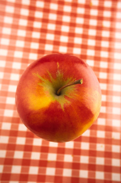 Big red apple lies on the table. Food. Cover.