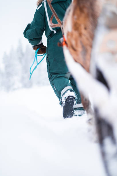 istock Guiding Person Walking Through the Snow Step by Step 2171706949